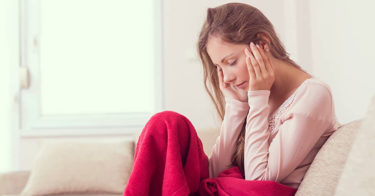 young woman feeling foggy and sad after head injury