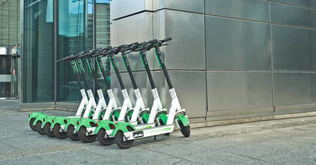 Lime electric scooters in front of an office building