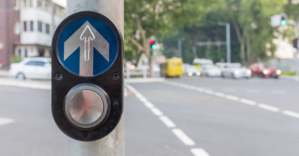 Walk signal at a pedestrian crossing | Henry Carus + Associates