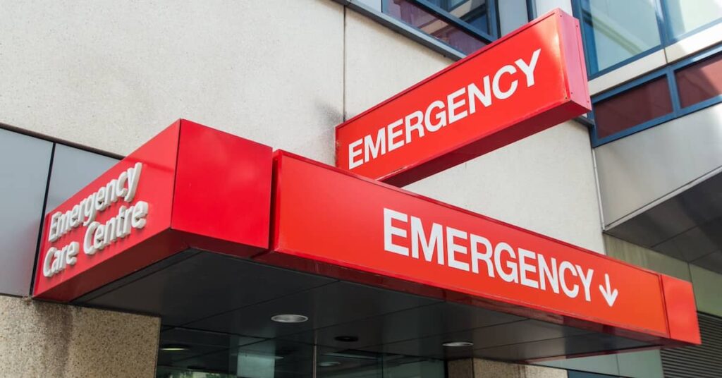 Sign outside an Emergency Care Centre in Melbourne, VIC | Henry Carus + Associates